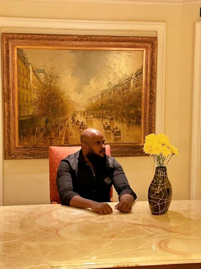 Owner portrait of Hyderabad Painters sitting at a table